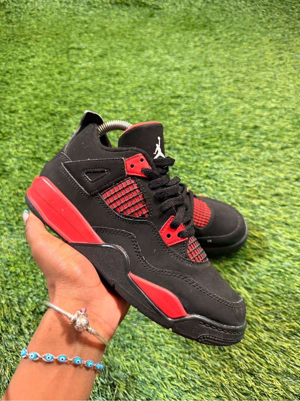 Jordan 4 Retro Red Thunder sneakers for youth size 3Y